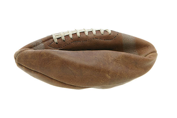 Flat Football Flat old leather football, ball shows wear and tear. deflated stock pictures, royalty-free photos & images
