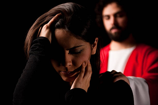 istock Depressed girl with Jesus behind her 182669721