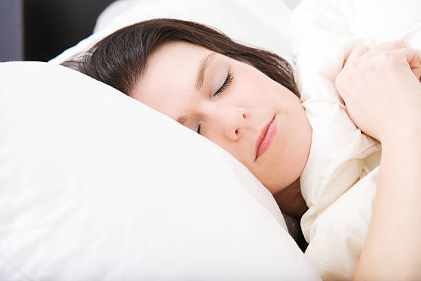 istock Beautiful Woman Sleeping 182669950