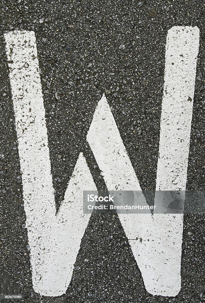 in A stenciled W on concrete. Alphabet Stock Photo