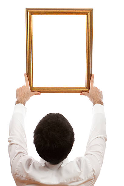 istock Young Men Holding Empty Picture Frame to The Sky 182670217
