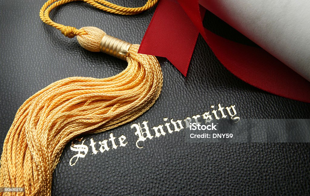 State University Graduation Diploma cover with gold tassel and diplomaTo see more of my education images click on the link below Achievement Stock Photo