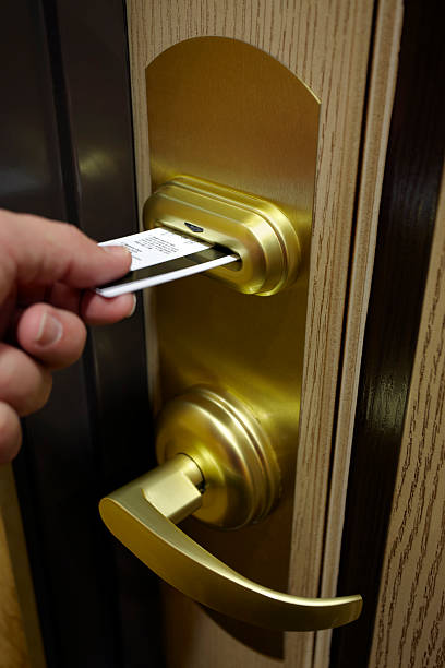 istock Male Hand Inserting Key Card Into Hotel Room Door Lock 182670352