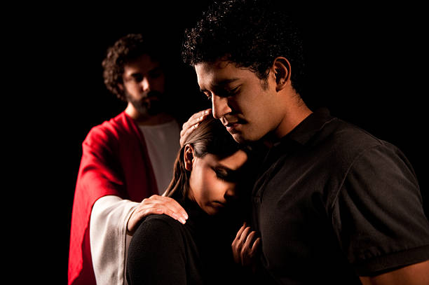 istock Religious couple with Jesus behind them 182670396