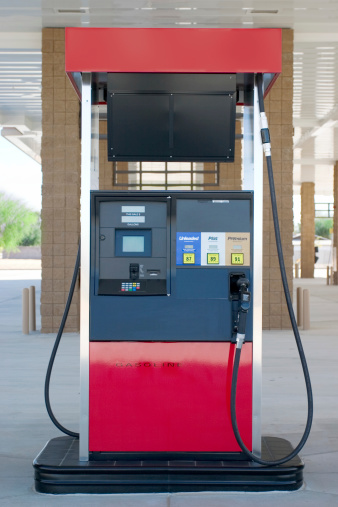 Man Refill and filling Oil Gas Fuel at station. Gas station - refueling. To fill the machine with fuel. Car fill with gasoline at a gas station. Gas station pump.