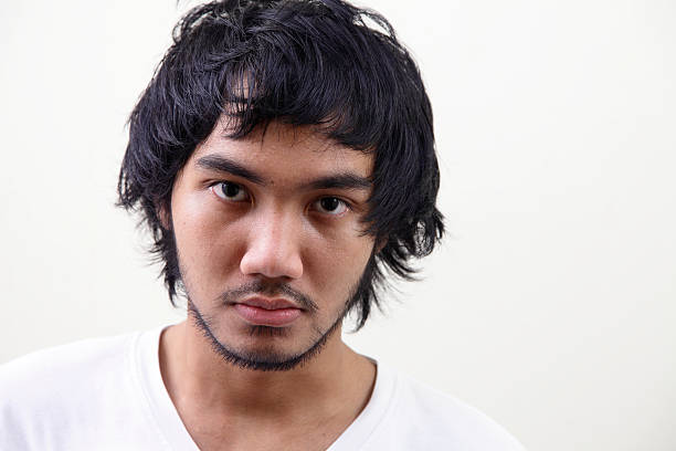 istock close up of sad young man 182670626