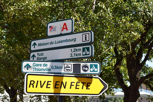 Thionville, France - 08/22/2023: signs with distances by bike