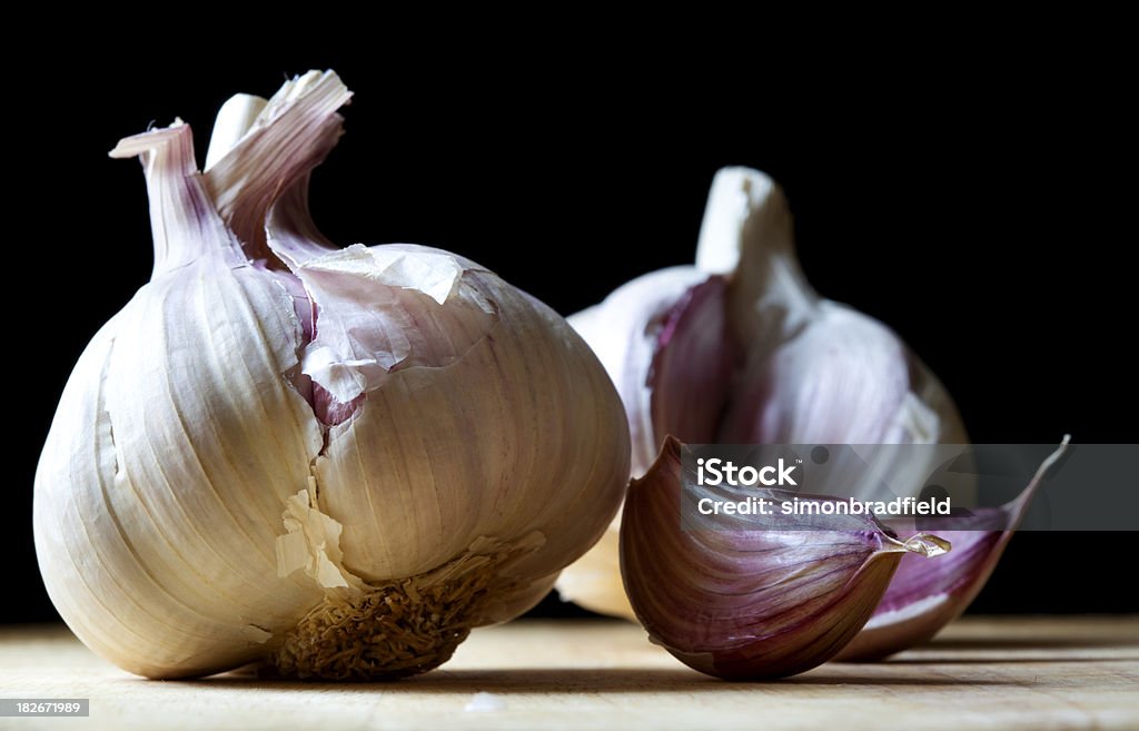 Garlic Horizontal image of some garlic. Cutting Board Stock Photo