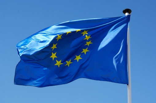CLOSE-UP OF THE YELLOW STARS OF EUROPEAN UNION FLAG.