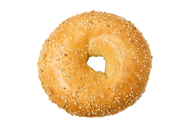Isolated close-up of of sesame bagel on a white background stock photo