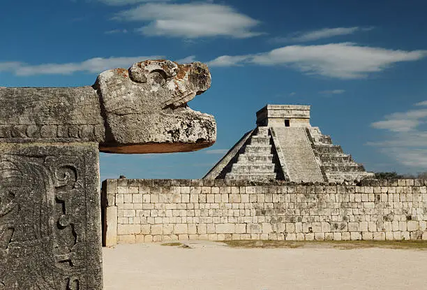 Chichenitza ruins - composition with serpent head and pyramid of Kukulkan during the Spring Equinox