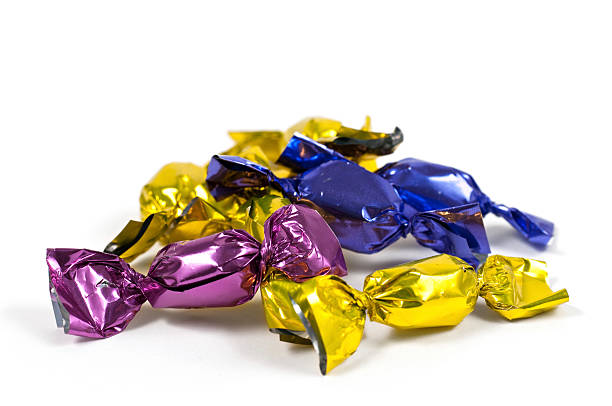 pila de coloridas candy - hard candy foil rolled up blue fotografías e imágenes de stock