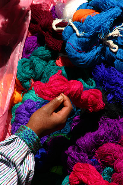 istock Hand with skeins of brightly colored yarn 182672715