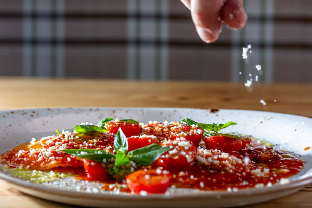 istock Spinach and ricotta ravioli with tomato sauce and parmesan. 1826731499