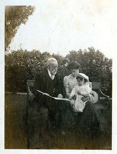 Edwardian family Vintage photograph of a Victorian / Edwardian grandfather with his daughter and grandson. Circa 1900 edwardian style photos stock pictures, royalty-free photos & images