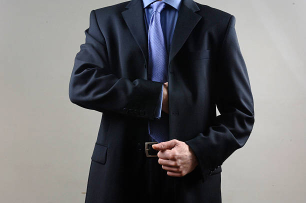 istock Businessman reaching into pocket 182673364