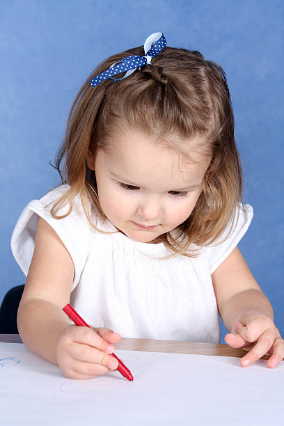 istock Little Two Year Old Girl Coloring 182673557