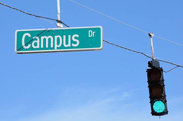 istock Campus street sign with green stoplight 182673779