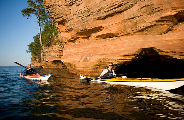 close-up view of the iconic sea caves at Meyers Beach, captured from the water during a serene sunset