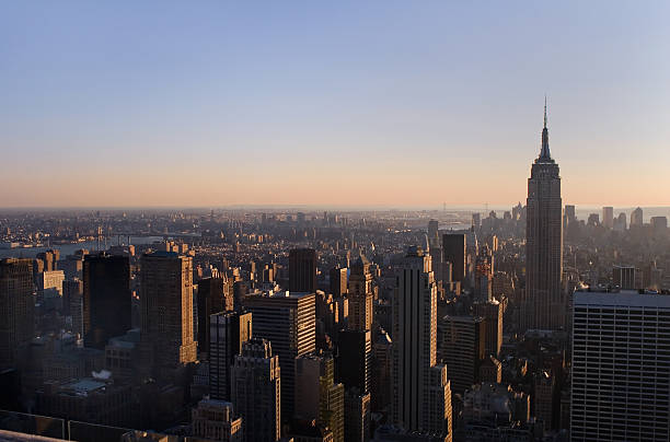 Aerial View of Empire State Building & Lower Manhattan near Suns stock photo