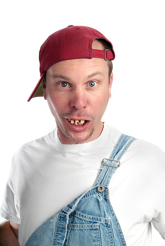 Man With Dumb Expression And Bad Teeth Wearing Overalls Stock Photo - Download Image Now - iStock