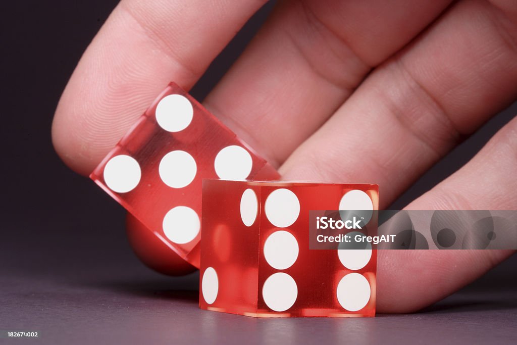 Hand Rolling Casino Dice A closeup of a hand rolling a set of casino quality craps diceSimilar: Chance Stock Photo