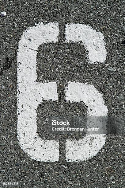A Number 6 Stenciled On Asphalt Stock Photo - Download Image Now - Asphalt, Black Color, Color Image
