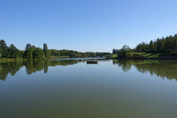 istock Pond lined with trees in the Paris region  Quiet scene 1826746314