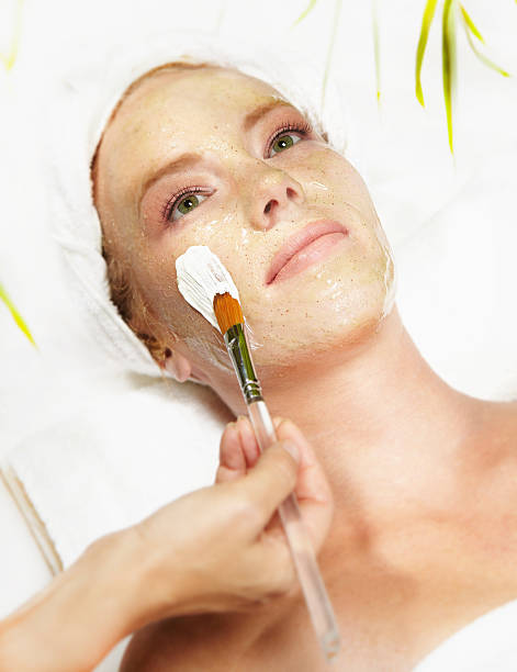 A young woman getting a facial stock photo