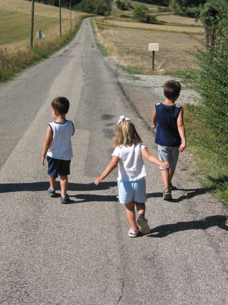 istock Boy And Girl Walking 182675241