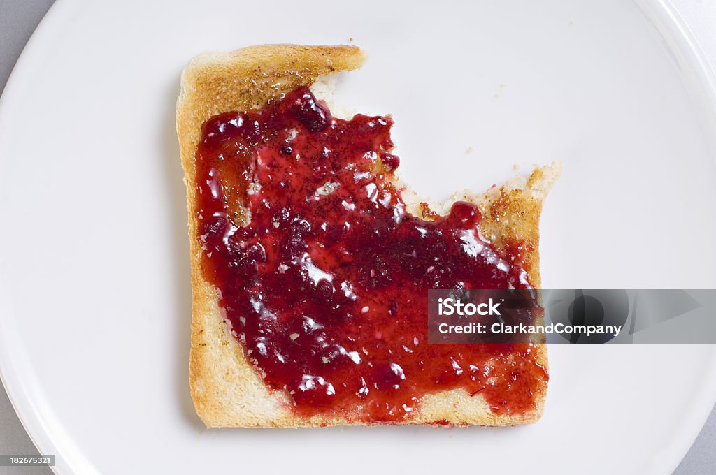 Hot Buttered Toast And Jam With A Bite Taken Out  Toasted Bread Stock Photo