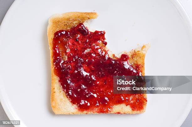 Hot Buttered Toast And Jam With A Bite Taken Out Stock Photo - Download Image Now - Toasted Bread, Preserves, Missing Bite