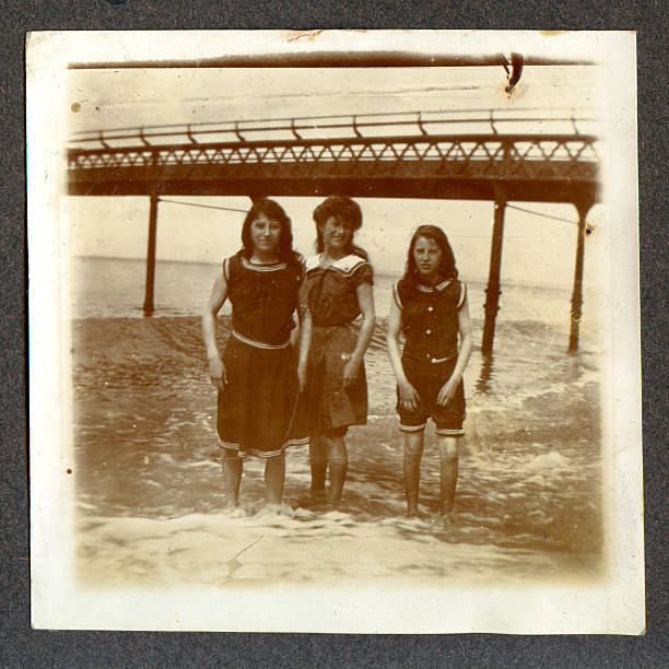 istock Edwardian girls by the seaside 182675347