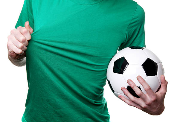 Football/Soccer fan wearing green with ball