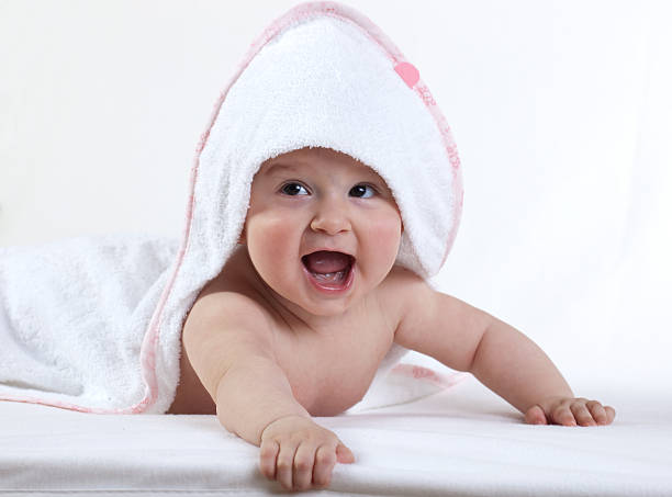 istock happy baby in white towel 182676049