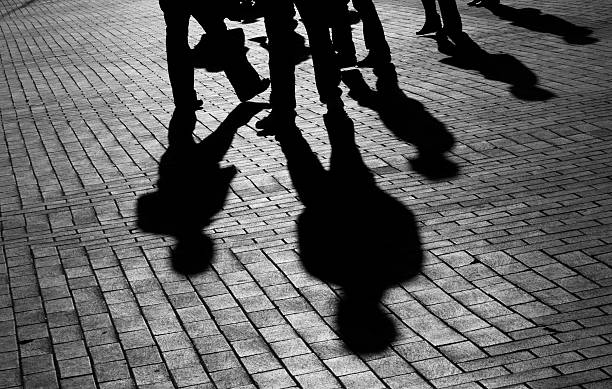 istock Shadows of walking people 182676058