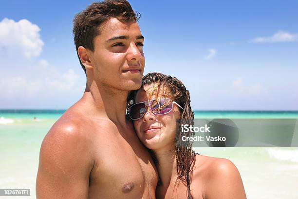 Couple At The Beach Stock Photo - Download Image Now - Bikini, Adult, Adults Only