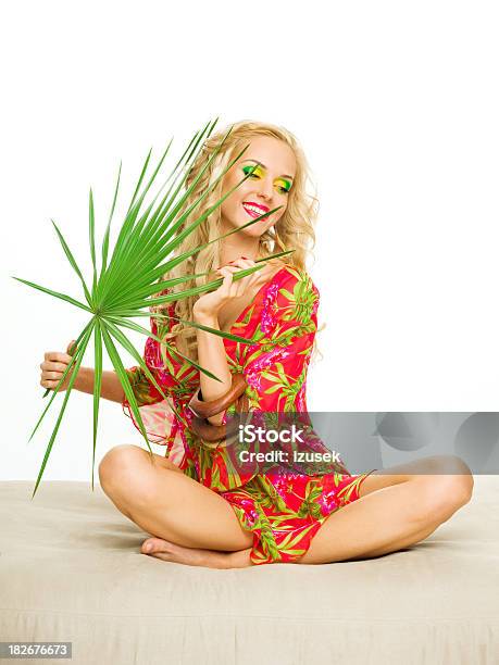 Beautiful Blonde Woman Holding Large Tropical Leaf Stock Photo - Download Image Now