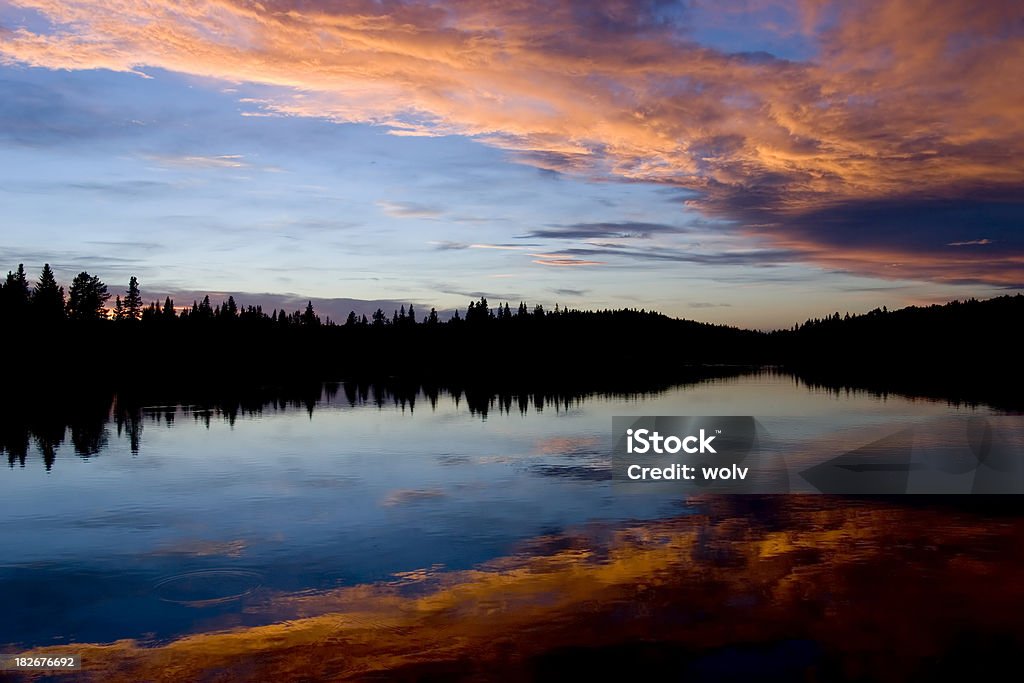 Reflections Mountain lake at dusk. Alberta Stock Photo