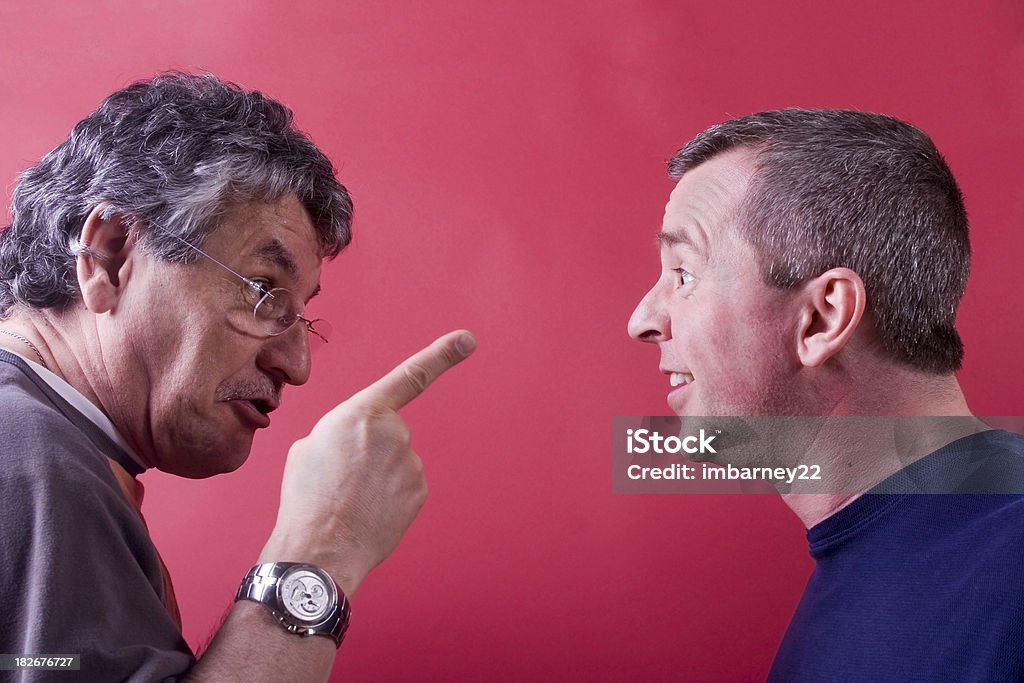 Warning Two men squared off in a confrontation Adult Stock Photo