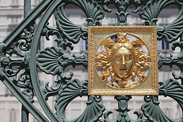 VERSAILLES, FRANCE - APRIL 14, 2015: Fragment of the golden gate of the Palace of Versailles in France