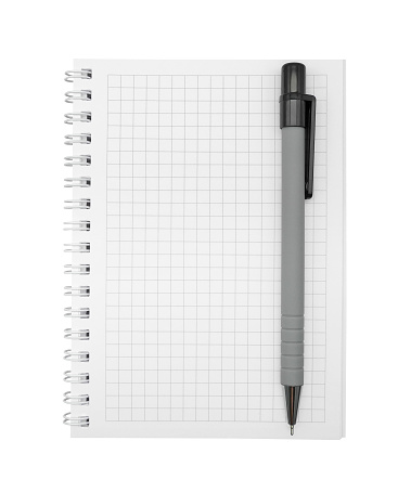 Vertical checkered spiral bound notepad or notebook with pen isolated on white background top view