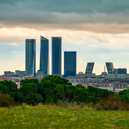 Skyscrapers in the city of Madrid at sunset on a rainy winter day