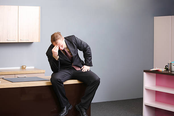 istock Stressed businessman in domestic kitchen 182677123