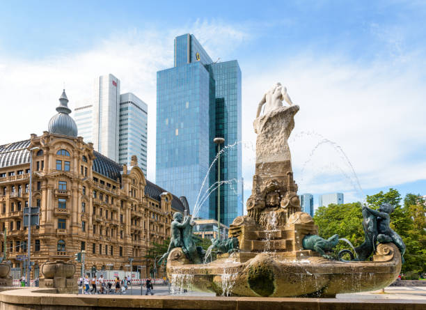 Frankfurt am Main, Germany - Aug. 17, 2023: Back of the Märchenbrunnen (Fairy Tale fountain) built in Art Nouveau style in 1910, with the Fürstenhof building, the Silberturm and Gallileo skyscrapers.