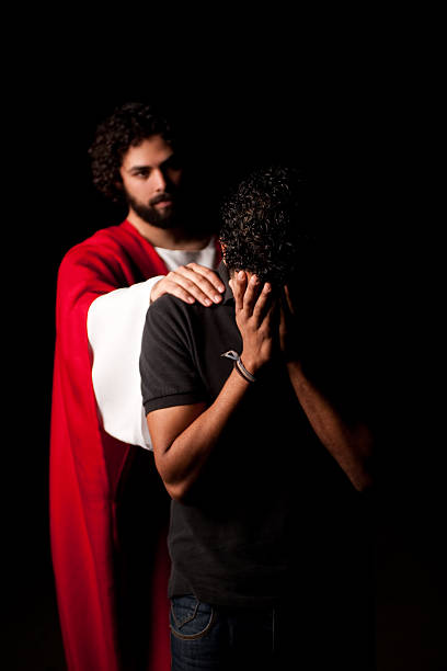 istock Unhappy man with Jesus behind him 182677459