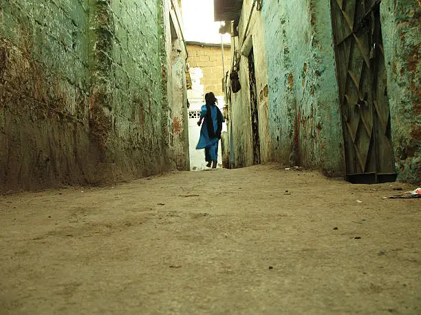 Photo of Girl in narrow alley