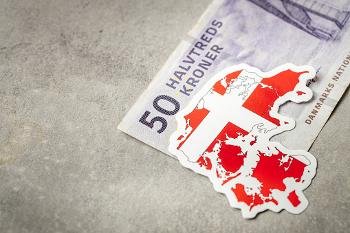 Denmark money, Danish 50 kroner bill, national flag and shape of Denmark, Financial concept business, gray background. copy space