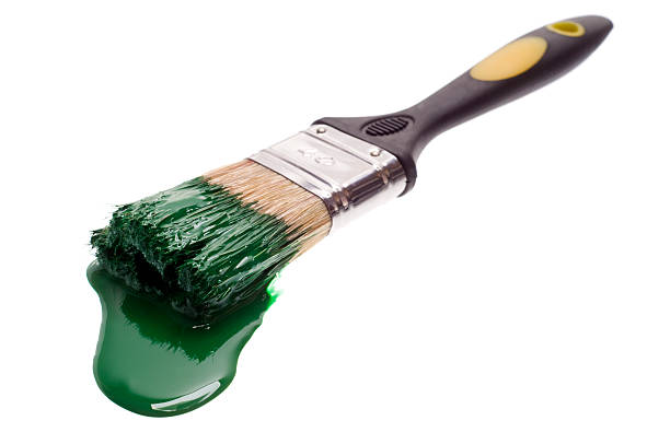 istock Paintbrush with blue paint on white 182677850