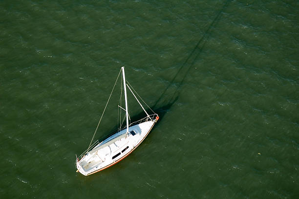 水のヨット - looking at view on top of nautical vessel high section ストックフォトと画像